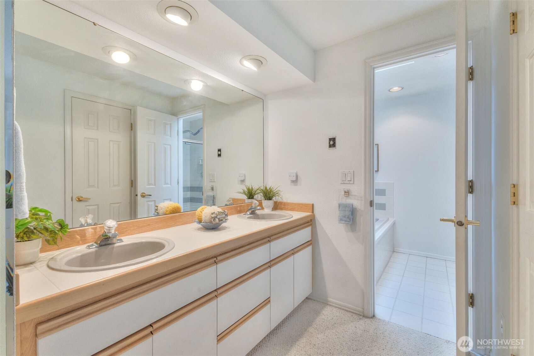 311 Keach Loop Steilacoom, WA 98388 - Photo 30 of 38 a bathroom with a sink and a mirror