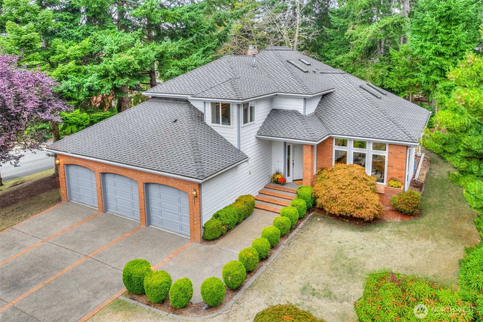 311 Keach Loop Steilacoom, WA 98388 - Photo 4 of 38 a aerial view of a house with a yard and potted plants