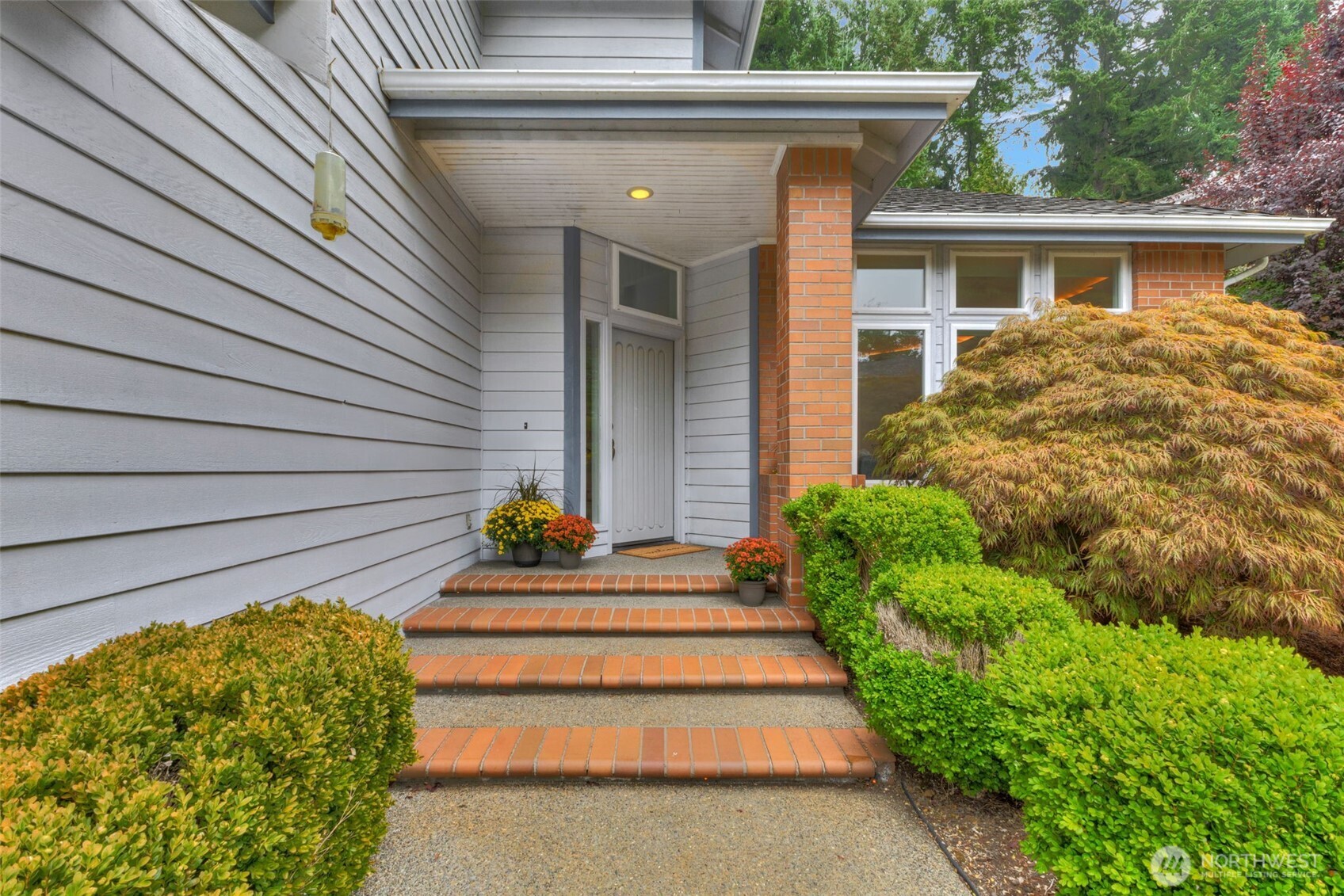 311 Keach Loop Steilacoom, WA 98388 - Photo 5 of 38 a view of house with backyard and garden