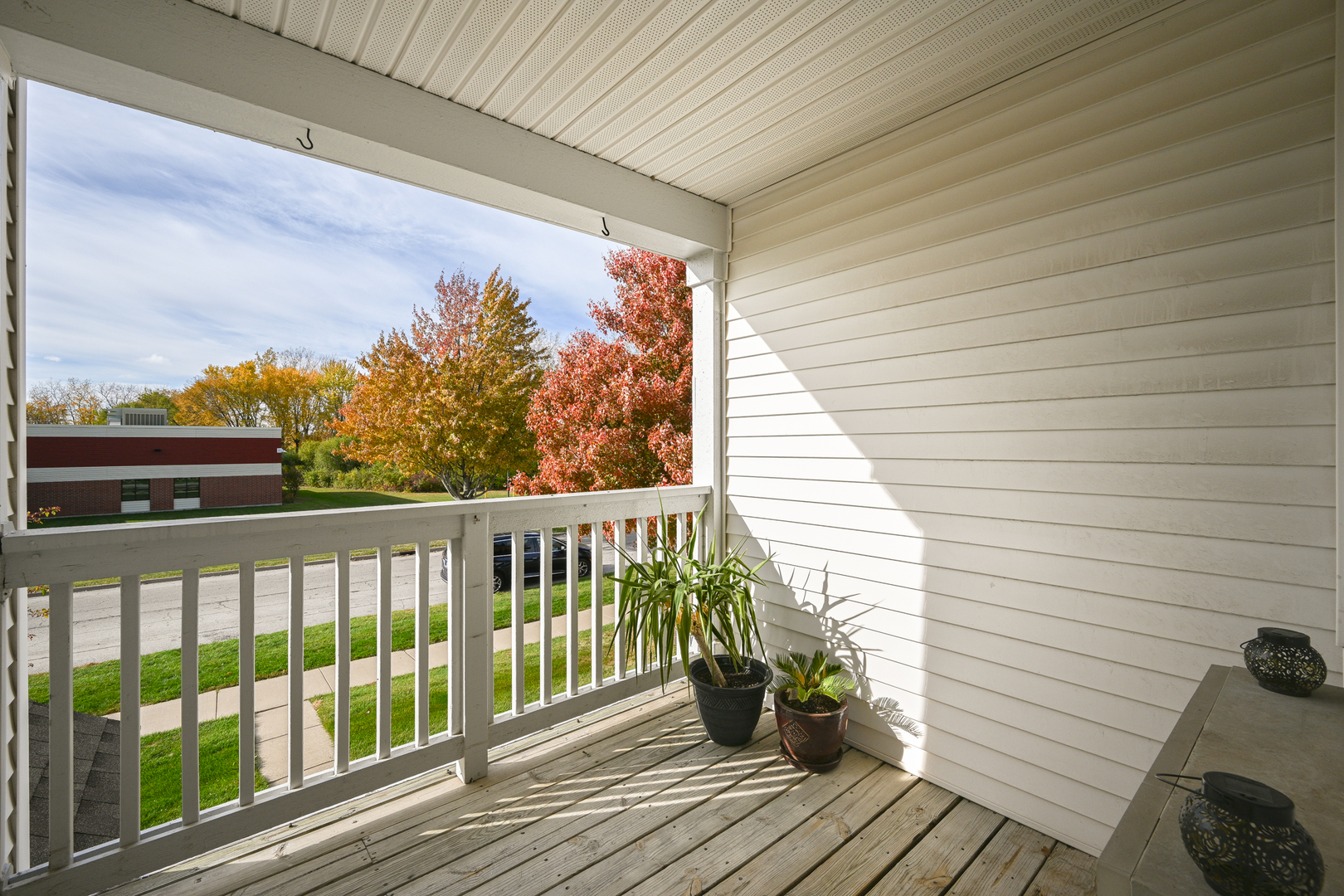 1425 McClure Road, Unit 1425 Aurora, IL 60505 - Photo 9 of 12 a view of a balcony with wooden floor