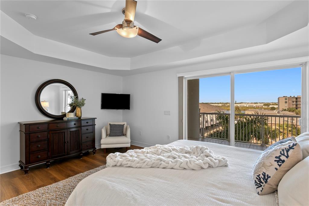 19730 Gulf Boulevard, Unit 400 Indian Rocks Beach, FL 33785 - Photo 66 of 90 a bedroom with a bed and a television