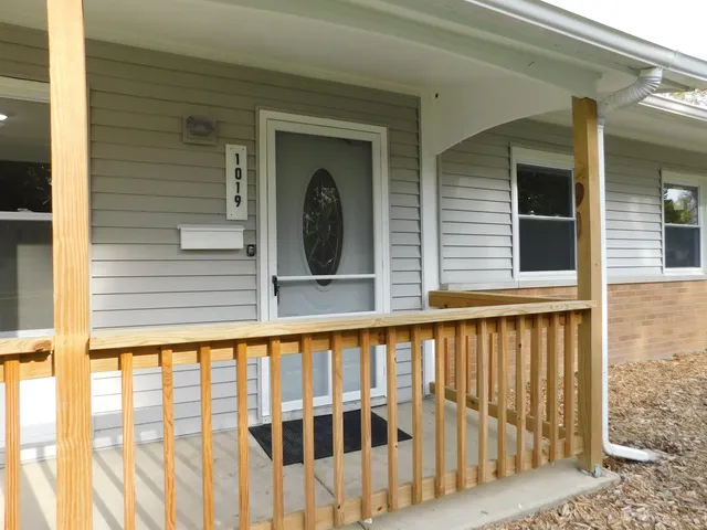 a view of a brick house with a large window