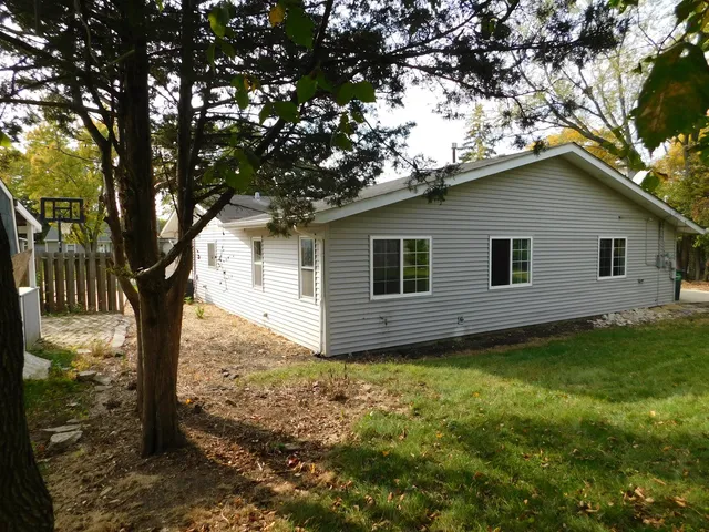 a backyard of a house with lots of green space