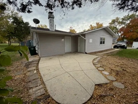 a view of a backyard of the house