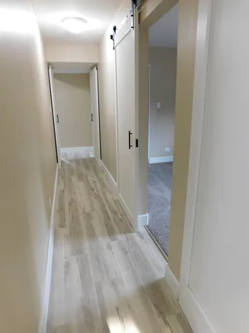 a view of a bathroom from a hallway