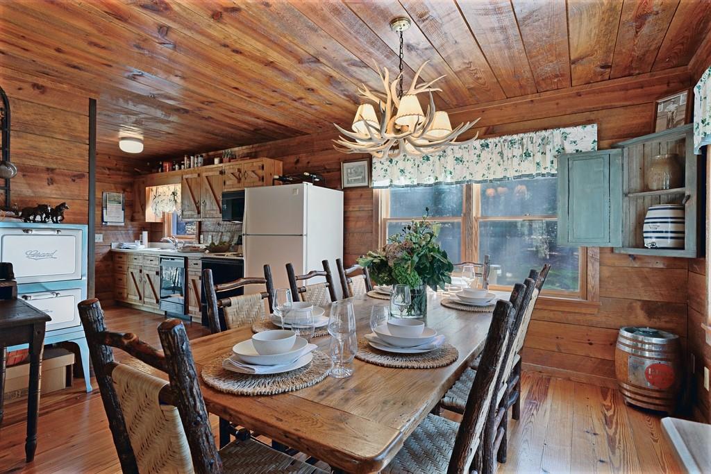 2320 Hardman Road Clarkesville, GA 30523 - Photo 30 of 53 a view of a dining room with furniture window and wooden floor