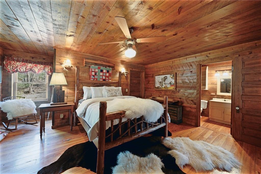 2320 Hardman Road Clarkesville, GA 30523 - Photo 36 of 53 a bed room with a bed and a chair