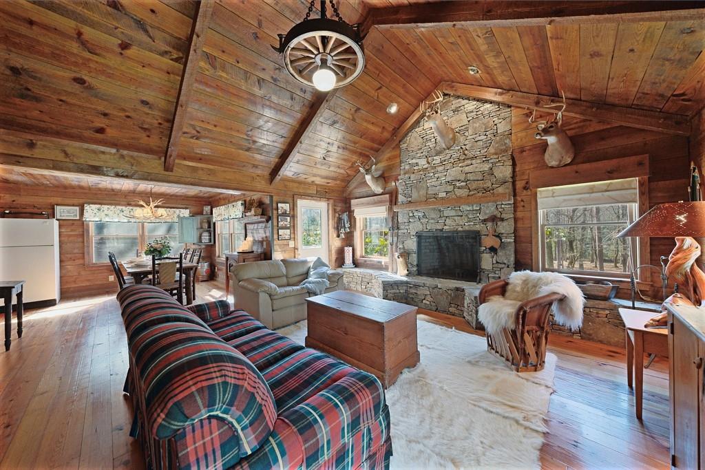 2320 Hardman Road Clarkesville, GA 30523 - Photo 38 of 53 a living room with patio furniture and a fireplace