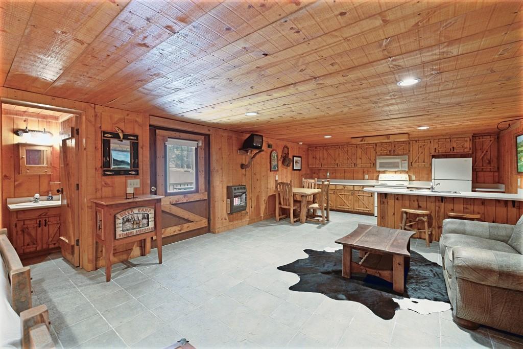 2320 Hardman Road Clarkesville, GA 30523 - Photo 43 of 53 a living room with furniture and a flat screen tv