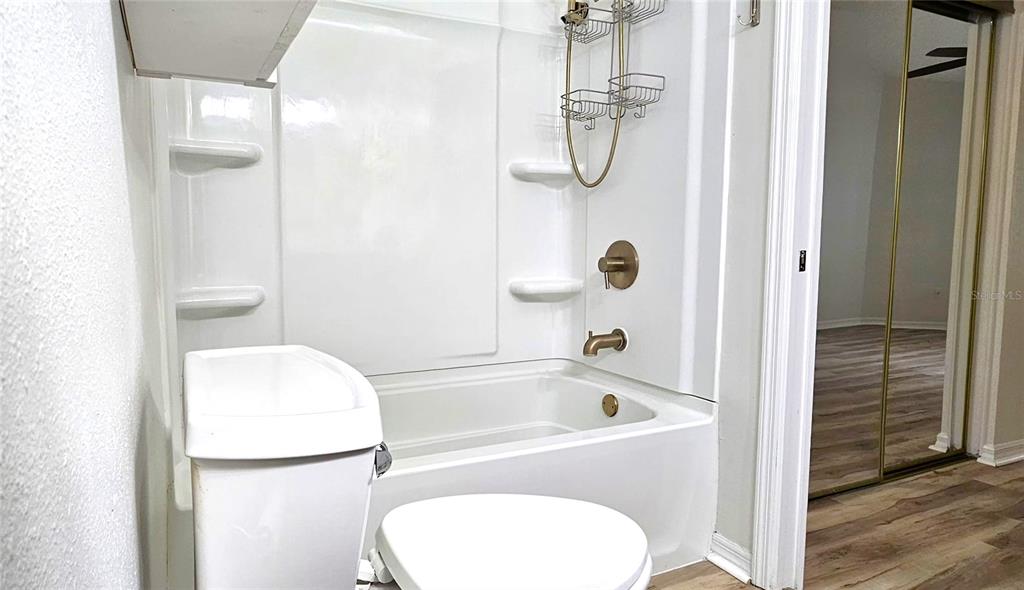 2736 Penzance Street Palm Harbor, FL 34684 - Photo 15 of 27 a bathroom with a tub a sink and a shower