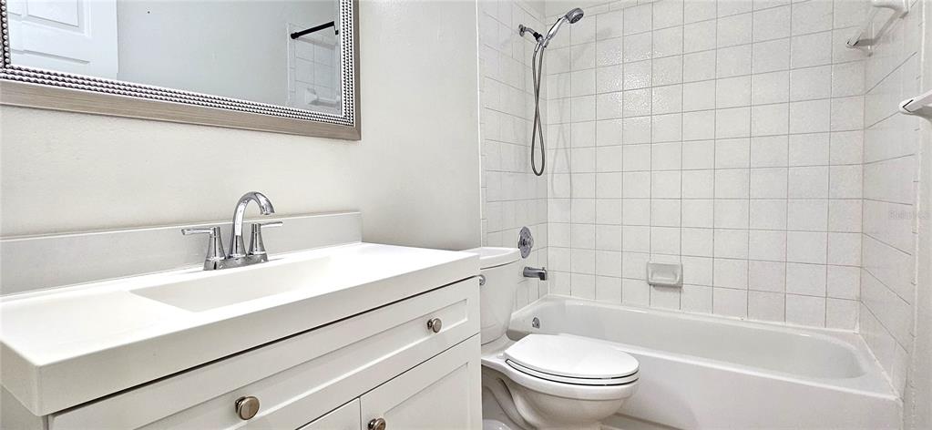 2736 Penzance Street Palm Harbor, FL 34684 - Photo 20 of 27 a bathroom with a sink a toilet and shower