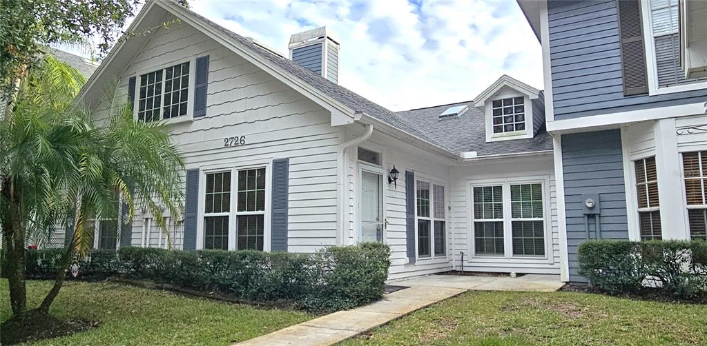2736 Penzance Street Palm Harbor, FL 34684 - Photo 2 of 27 a house with a garden view