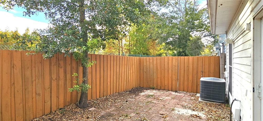 2736 Penzance Street Palm Harbor, FL 34684 - Photo 25 of 27 a view of outdoor space with wooden fence