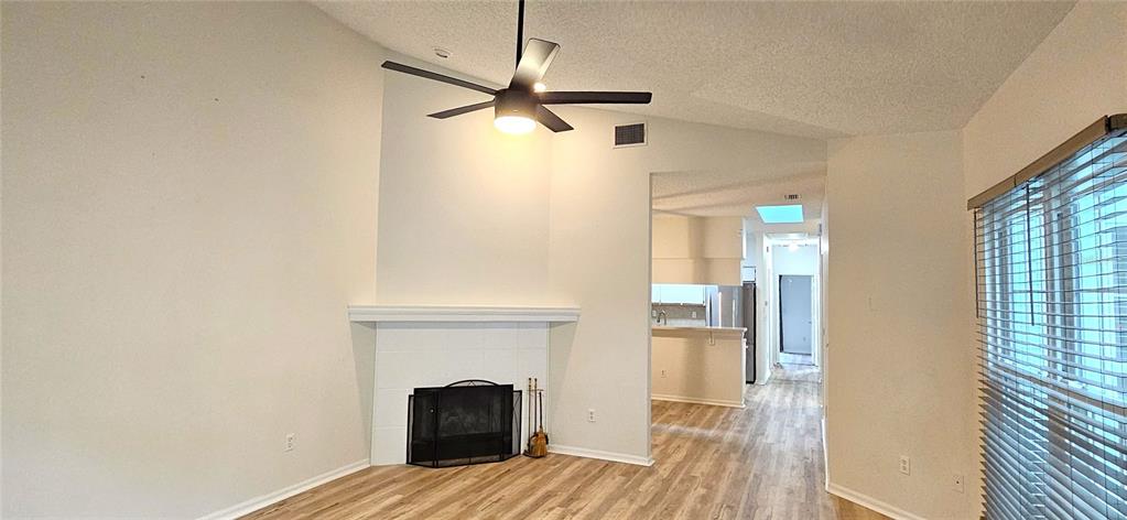 2736 Penzance Street Palm Harbor, FL 34684 - Photo 5 of 27 a view of empty room with fireplace and wooden floor
