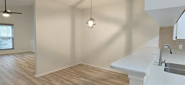 a bathroom with a sink and vanity