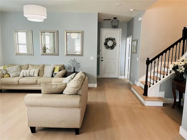 a living room with furniture and a couch