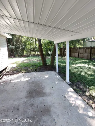 a view of backyard with green space