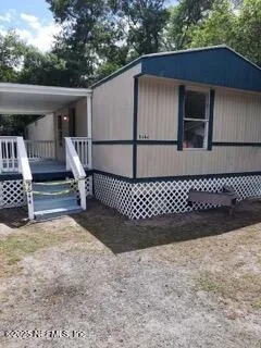 a kitchen with granite countertop a sink and cabinets