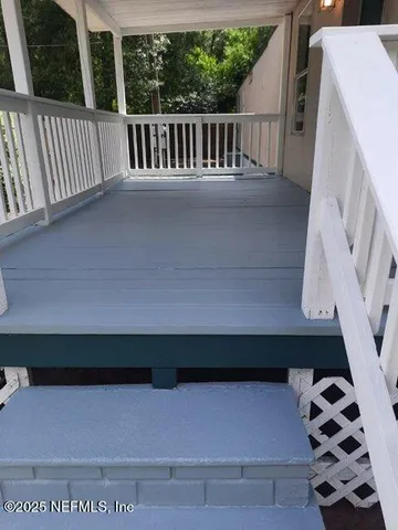 a kitchen with a sink cabinets and a window