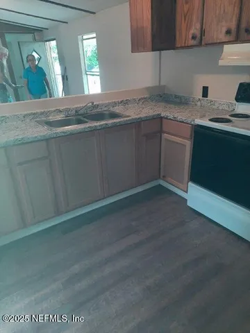 a white toilet sitting next to a shower