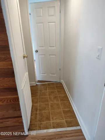 a bathroom with a toilet and a bathtub