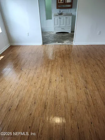 a white toilet sitting next to a bath tub