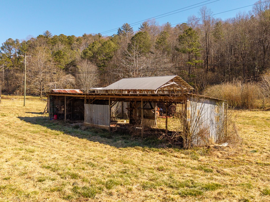 7589 Tails Creek Road Ellijay, GA 30540 - Photo 15 of 44 a view of a house with a yard