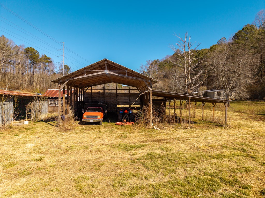7589 Tails Creek Road Ellijay, GA 30540 - Photo 16 of 44 a view of a house with a yard