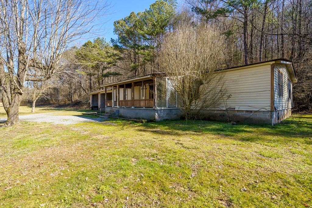 7589 Tails Creek Road Ellijay, GA 30540 - Photo 28 of 44 a view of a house with a yard