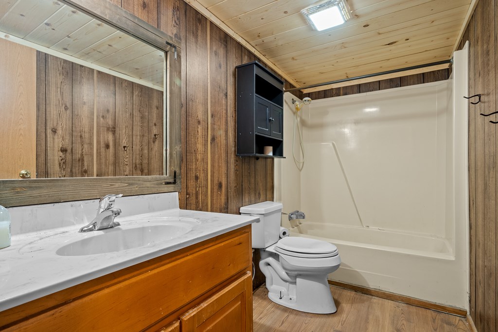 7589 Tails Creek Road Ellijay, GA 30540 - Photo 36 of 44 a bathroom with a sink toilet and shower
