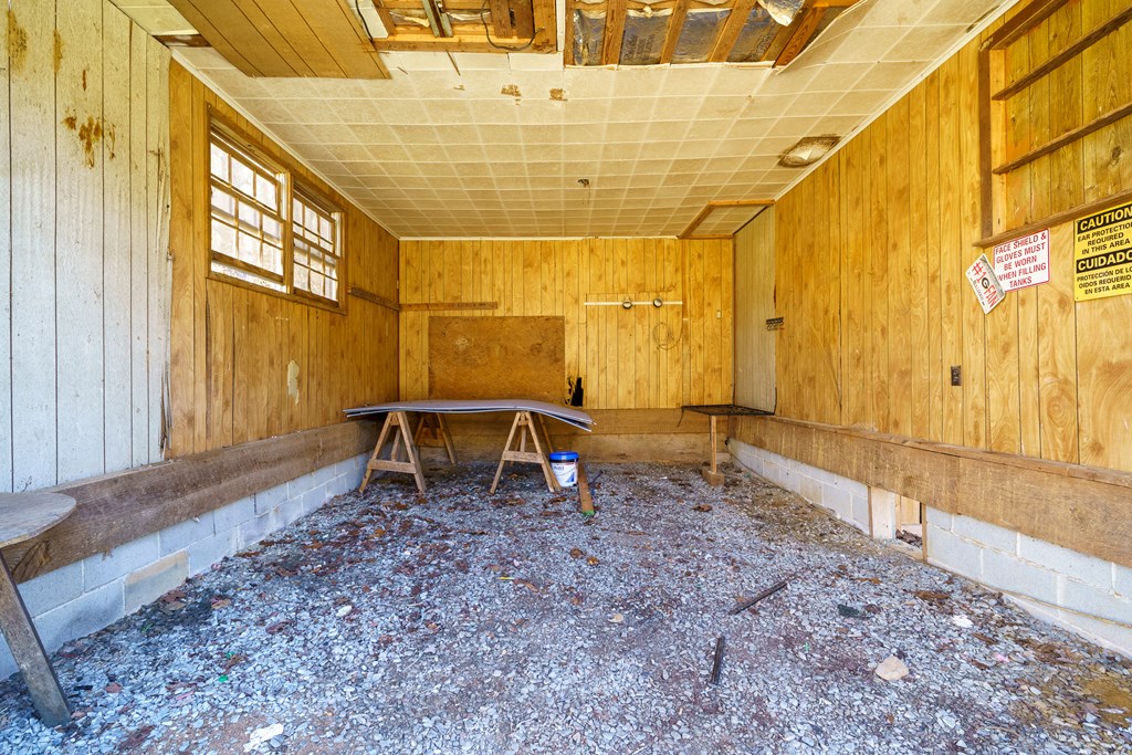 7589 Tails Creek Road Ellijay, GA 30540 - Photo 44 of 44 a view of an empty room with wooden floor and a window