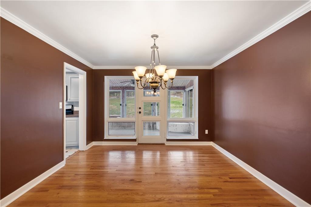 3240 Apache Road Pittsburgh, PA 15241 - Photo 8 of 25 a view of a livingroom with a chandelier wooden floor and a chandelier