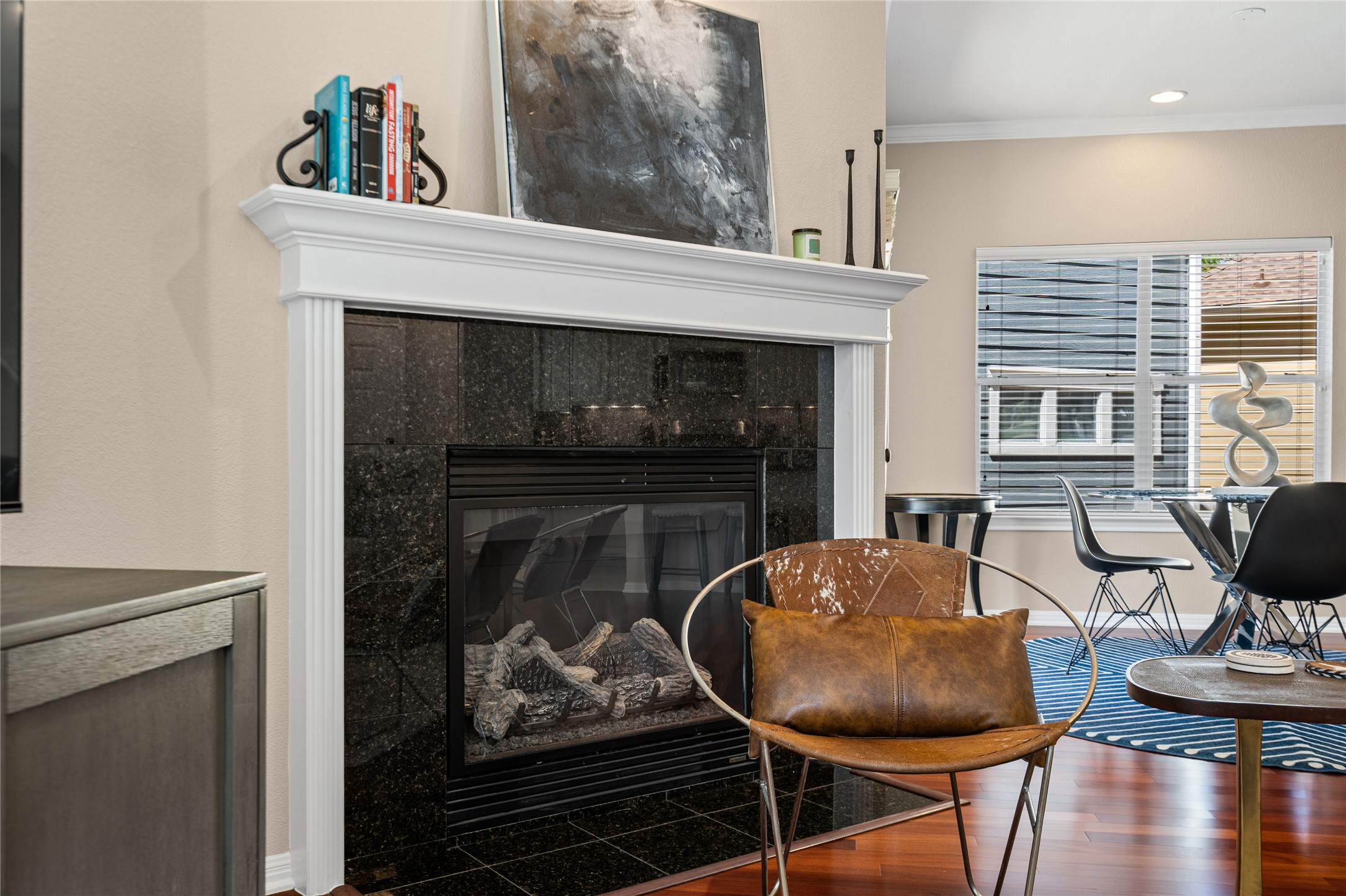 411 West St Elmo Road, Unit 24 Austin, TX 78745 - Photo 10 of 29 a living room with furniture a fireplace and wall paintings