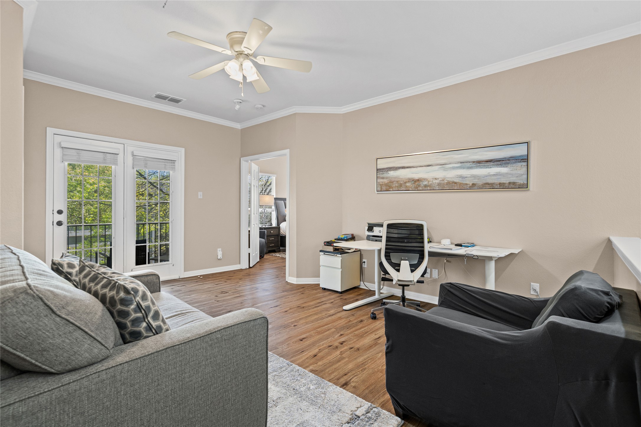 411 West St Elmo Road, Unit 24 Austin, TX 78745 - Photo 12 of 29 a living room with furniture and a flat screen tv