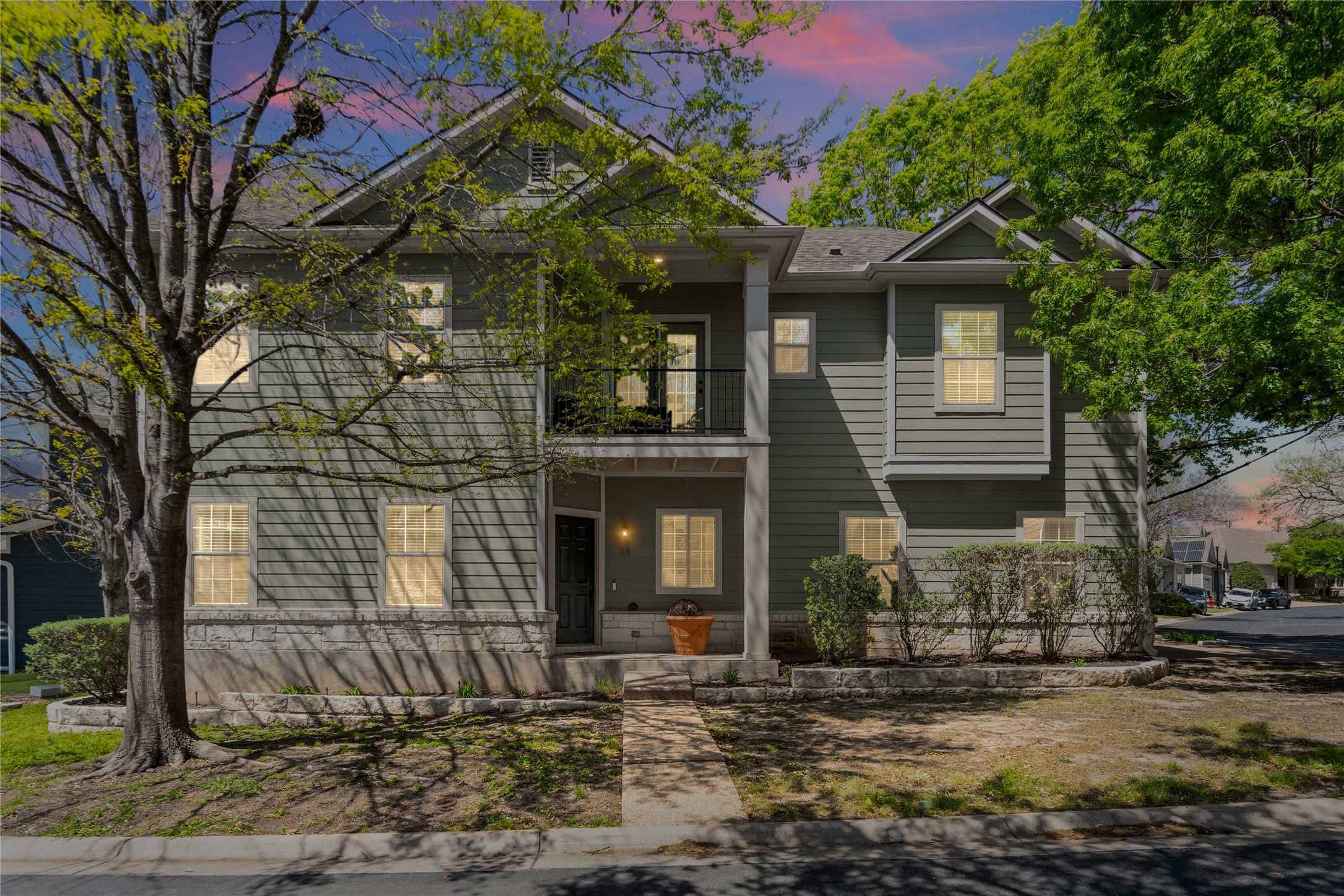 411 West St Elmo Road, Unit 24 Austin, TX 78745 - Photo 2 of 29 a front view of a house with a yard