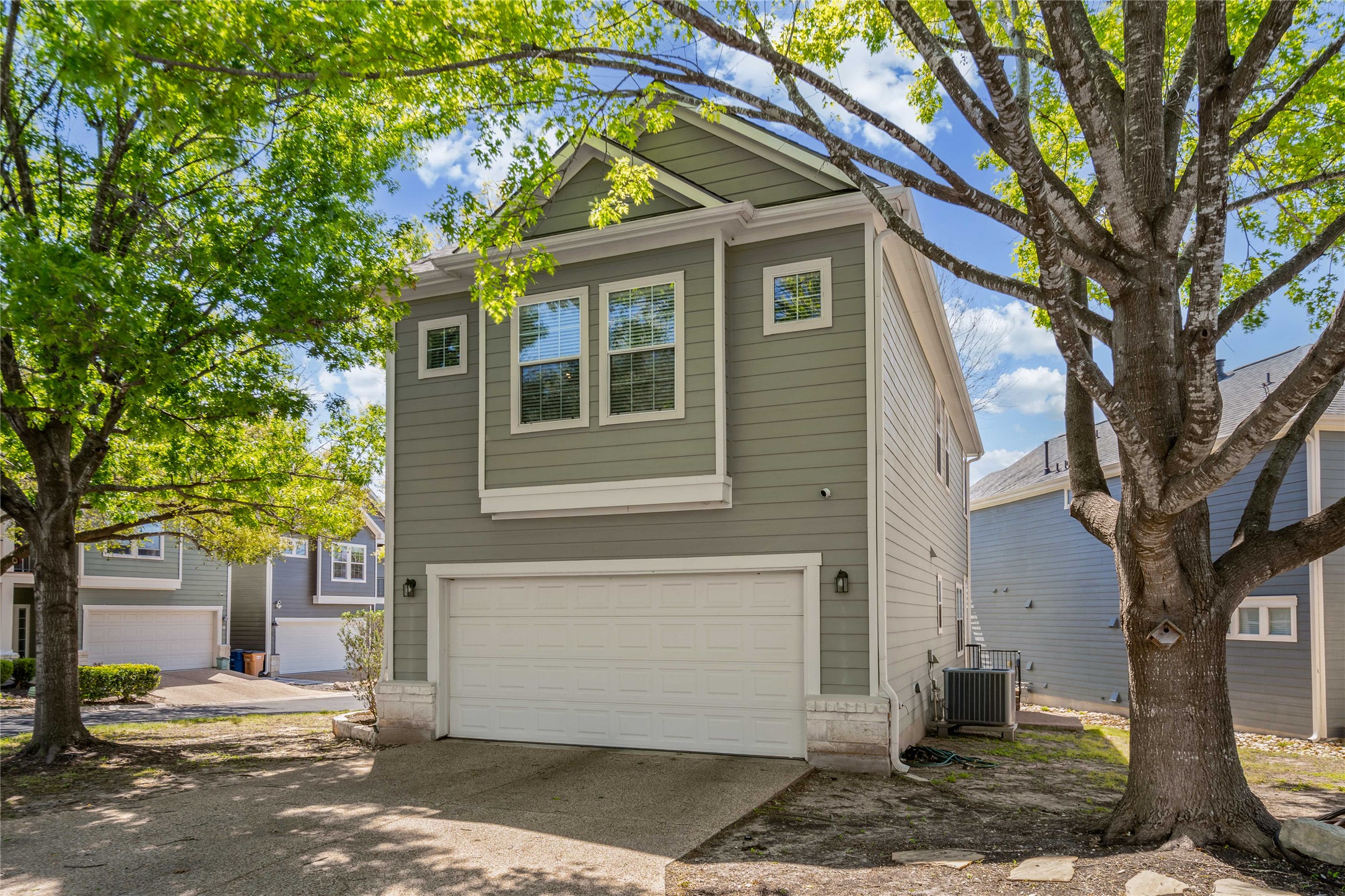 411 West St Elmo Road, Unit 24 Austin, TX 78745 - Photo 25 of 29 a front view of a house with a yard