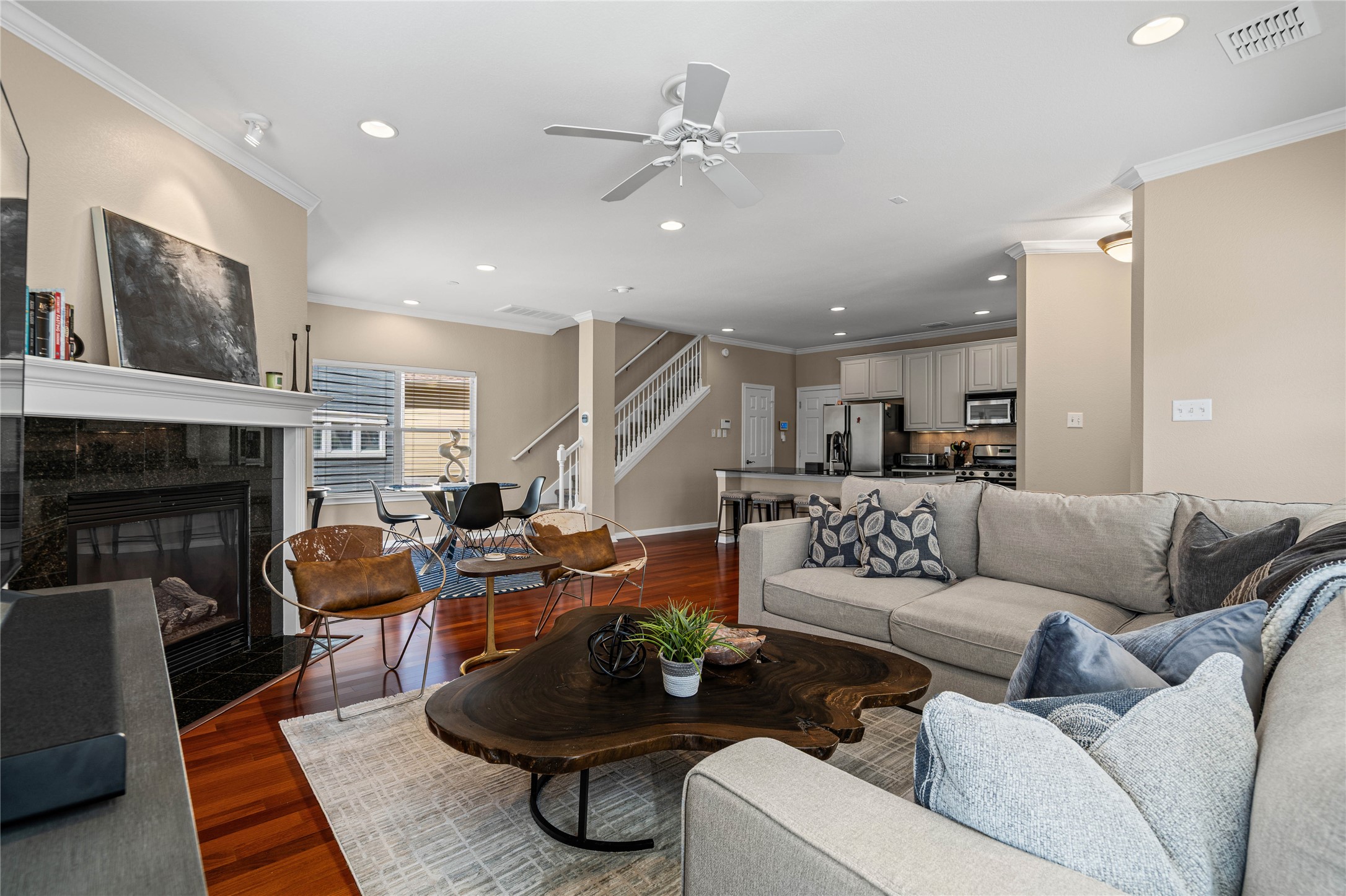 411 West St Elmo Road, Unit 24 Austin, TX 78745 - Photo 4 of 29 a living room with furniture and a fireplace