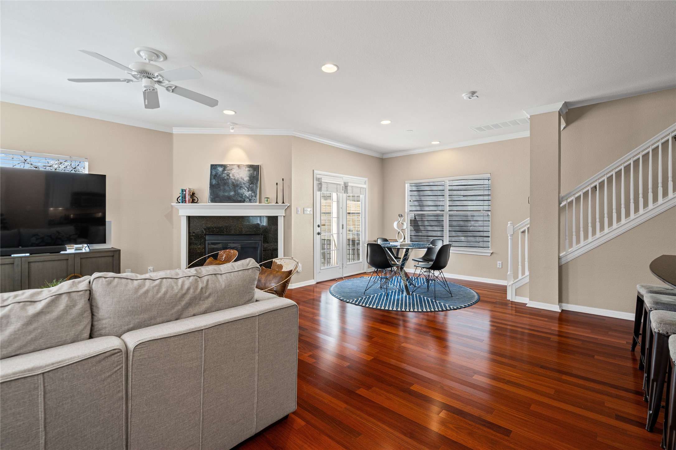 411 West St Elmo Road, Unit 24 Austin, TX 78745 - Photo 8 of 29 a living room with furniture a flat screen tv and a fireplace