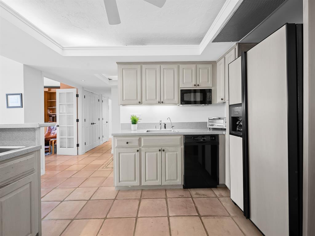 3400 Galt Ocean Drive, Unit 1202S Fort Lauderdale, FL 33308 - Photo 13 of 36 a kitchen with stainless steel appliances granite countertop a refrigerator and a stove top oven