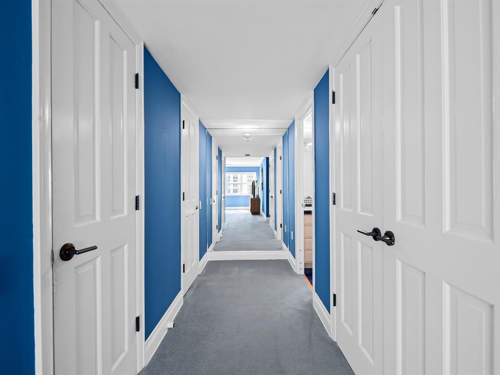 3400 Galt Ocean Drive, Unit 1202S Fort Lauderdale, FL 33308 - Photo 20 of 36 a view of a hallway with wooden floor and closet area
