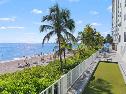 a view of swimming pool from a balcony