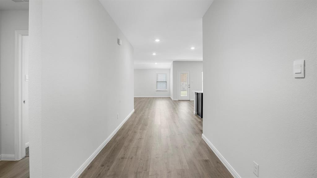 1921 Reveille Way Terrell, TX 75160 - Photo 10 of 30 a view of hallway with wooden floor