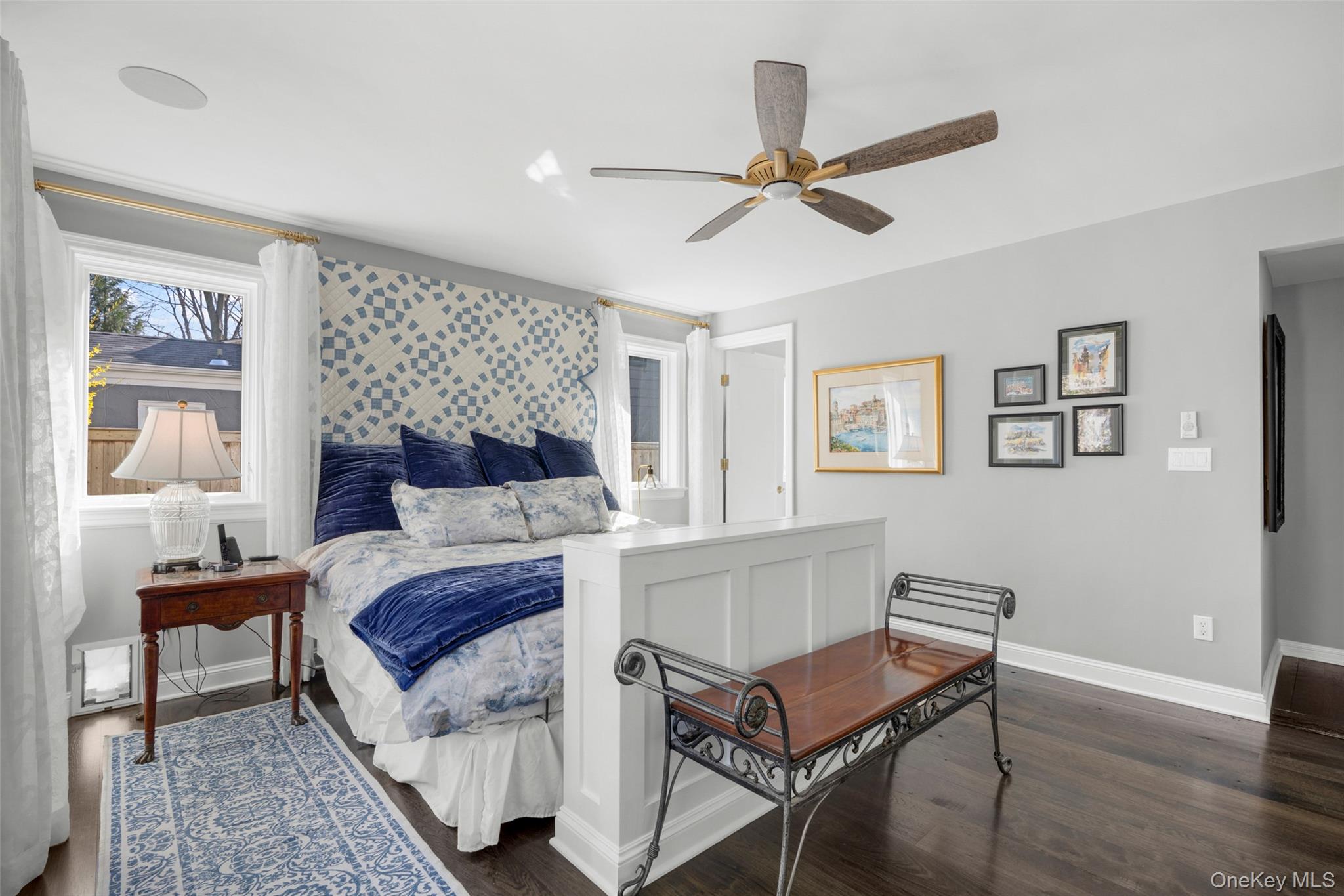 58 Burkewood Road Mount Vernon, NY 10552 - Photo 14 of 43 a bedroom with a bed and a chandelier