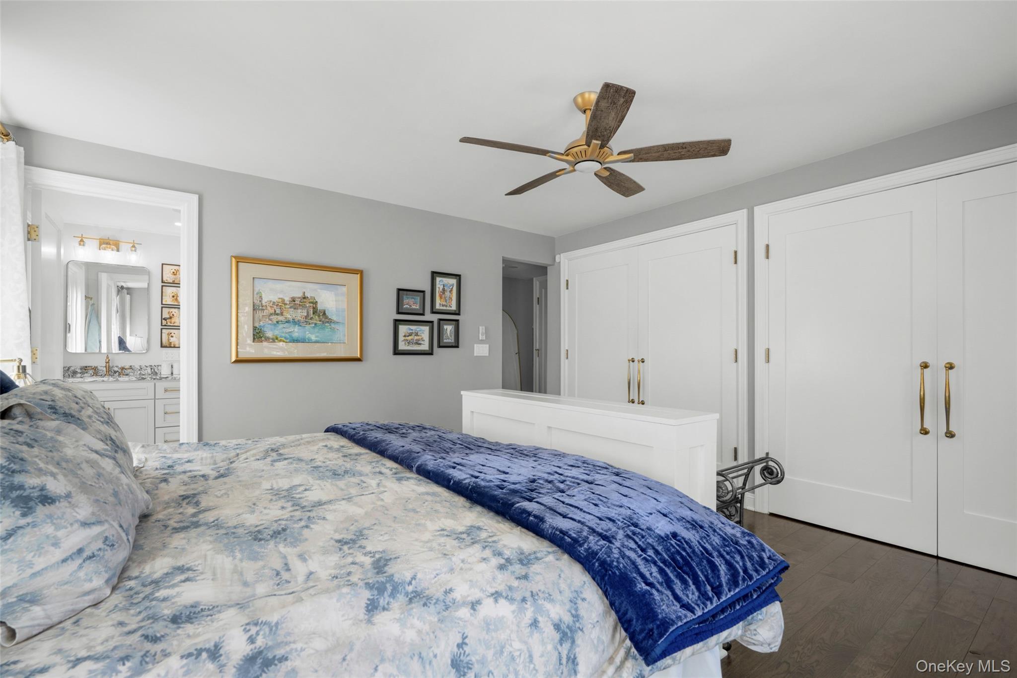 58 Burkewood Road Mount Vernon, NY 10552 - Photo 15 of 43 a bedroom with a large bed and a chandelier