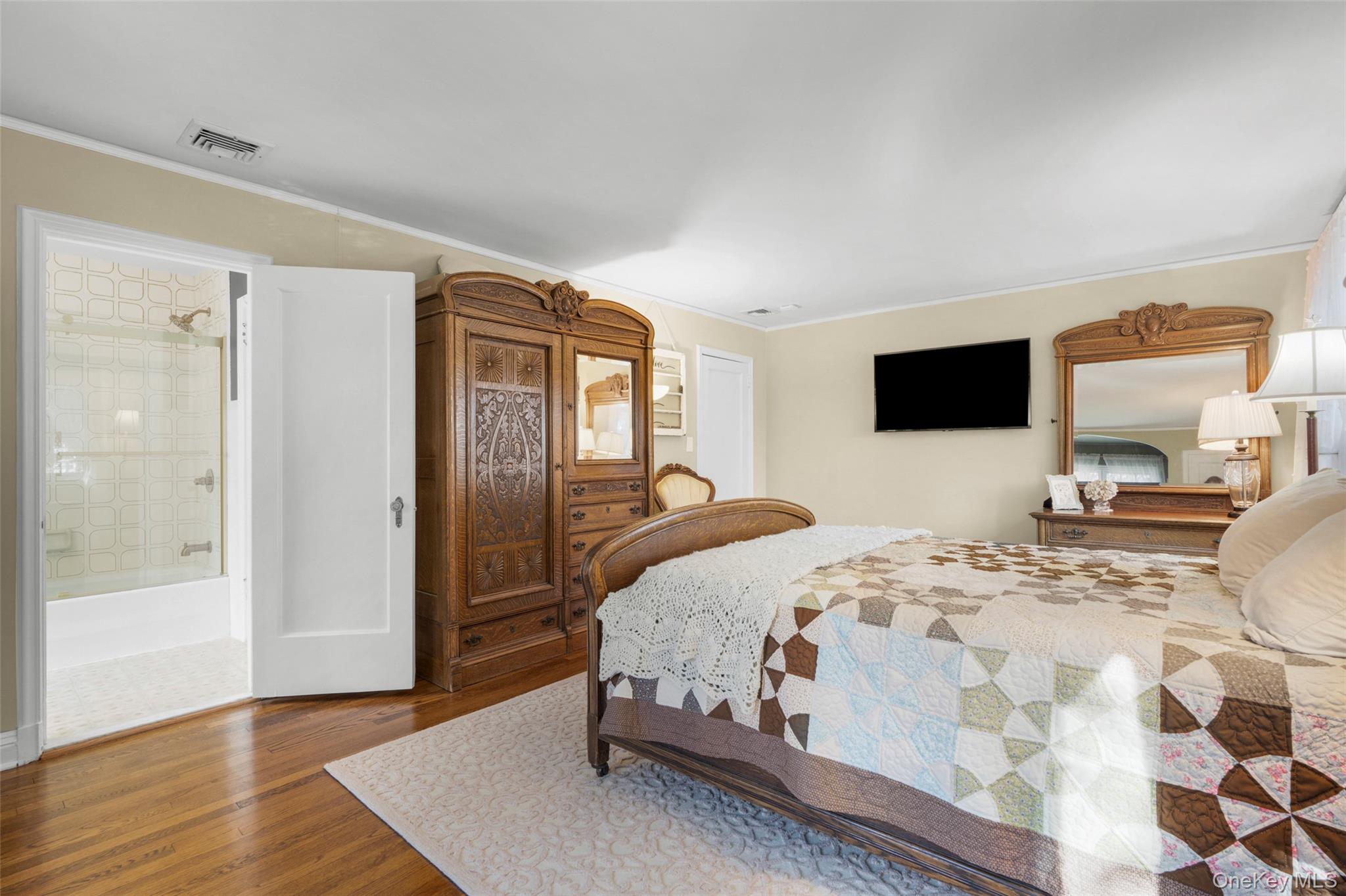 58 Burkewood Road Mount Vernon, NY 10552 - Photo 26 of 43 a bedroom with a bed a mirror and desk