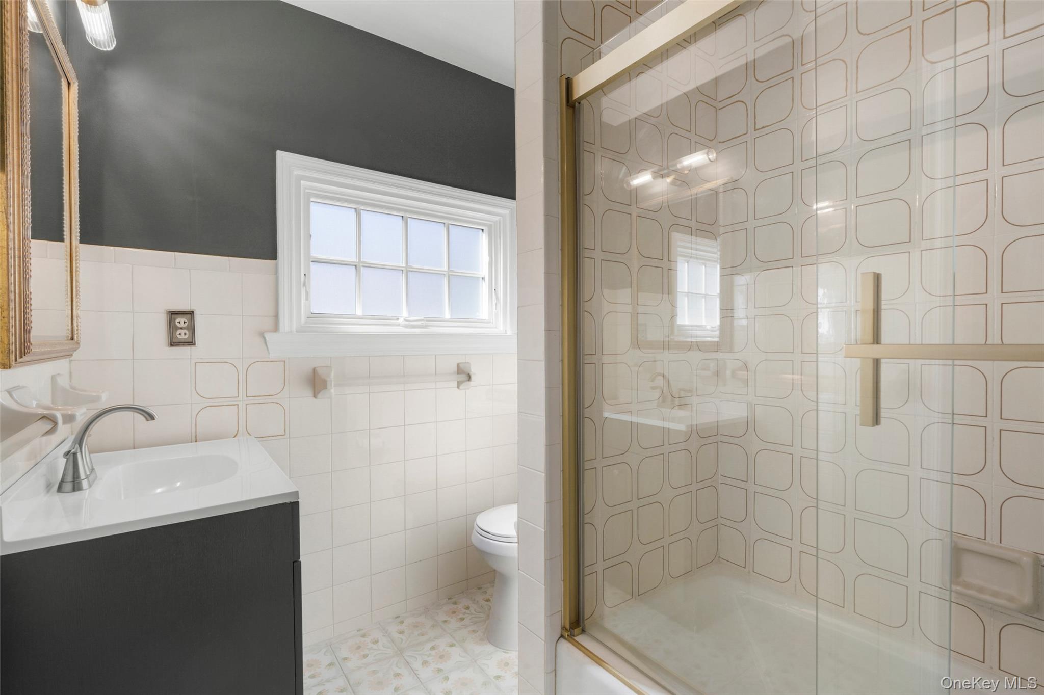 58 Burkewood Road Mount Vernon, NY 10552 - Photo 27 of 43 a bathroom with a sink a toilet and shower