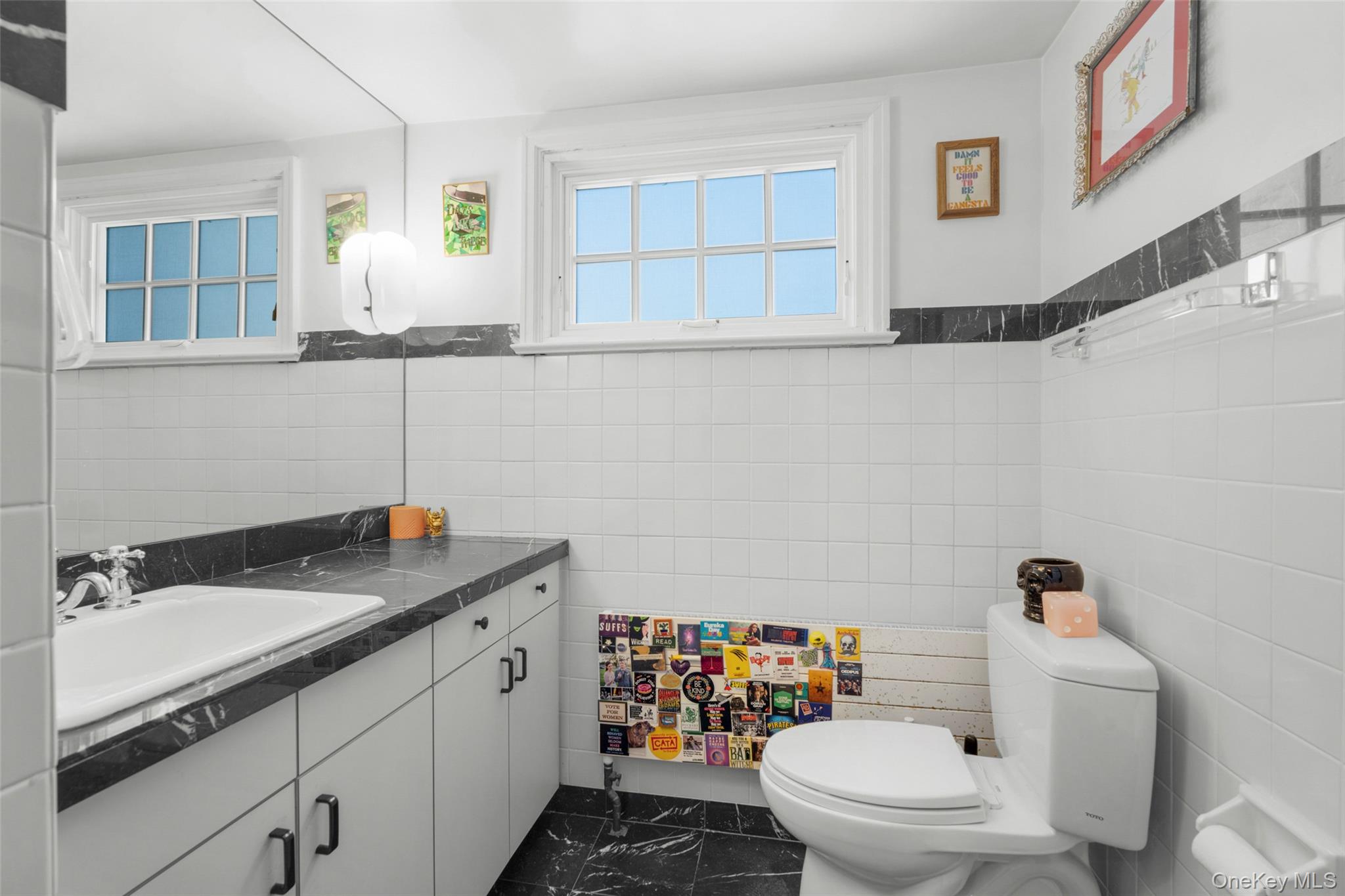 58 Burkewood Road Mount Vernon, NY 10552 - Photo 29 of 43 a bathroom with a granite countertop sink a mirror and a toilet