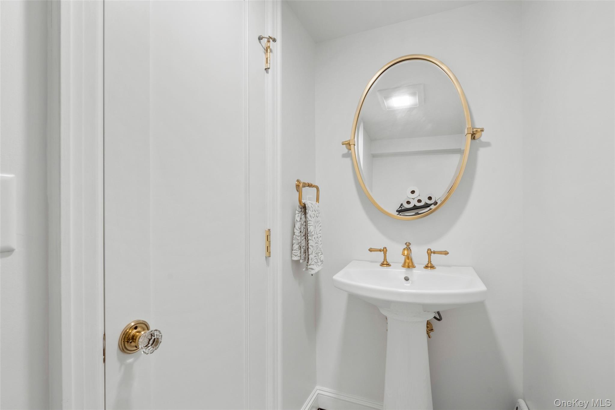 58 Burkewood Road Mount Vernon, NY 10552 - Photo 33 of 43 a bathroom with a sink and a mirror