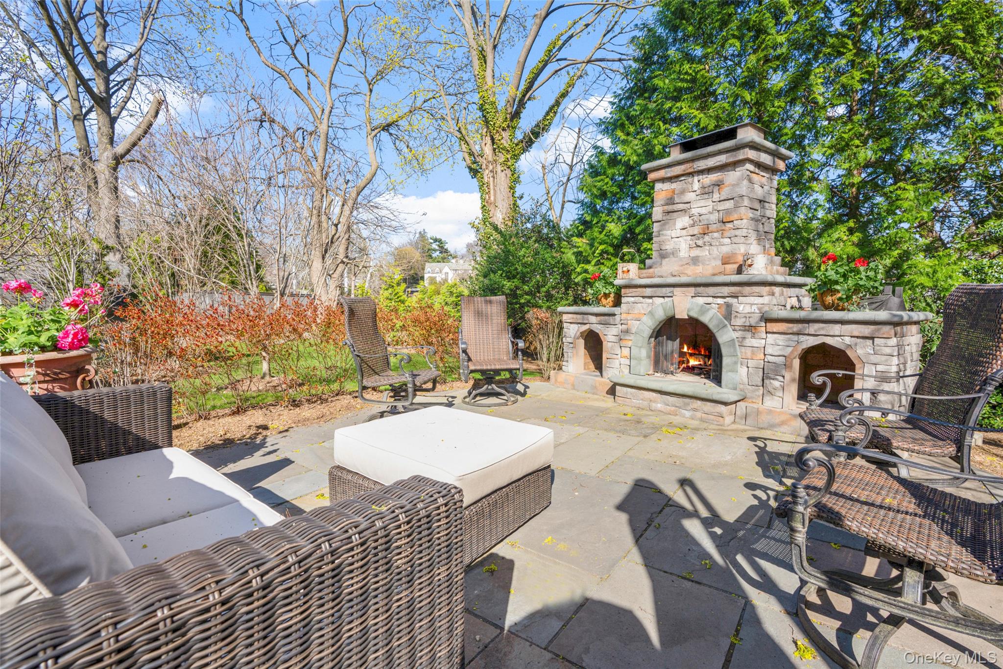 58 Burkewood Road Mount Vernon, NY 10552 - Photo 36 of 43 a view of a patio with couches table and chairs and potted plants