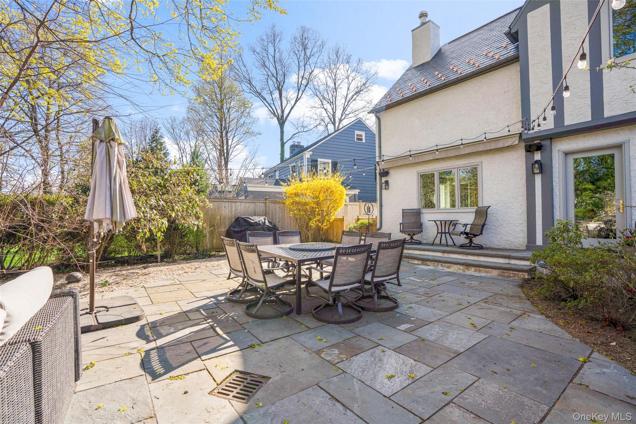 58 Burkewood Road Mount Vernon, NY 10552 - Photo 38 of 43 a view of a patio with table and chairs and potted plants